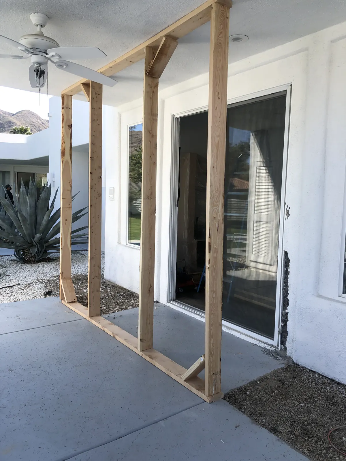New framing and headers for a wall of glass doors
