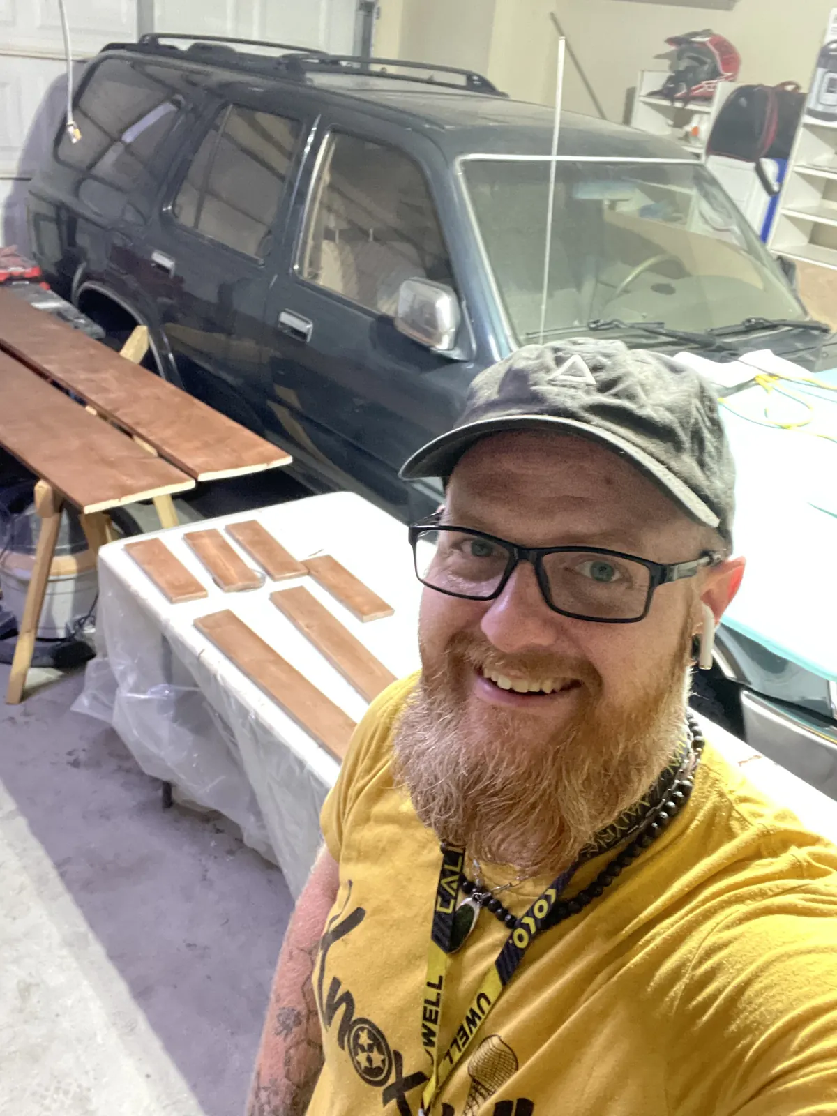 Owner by his truck with boards laid out to finish