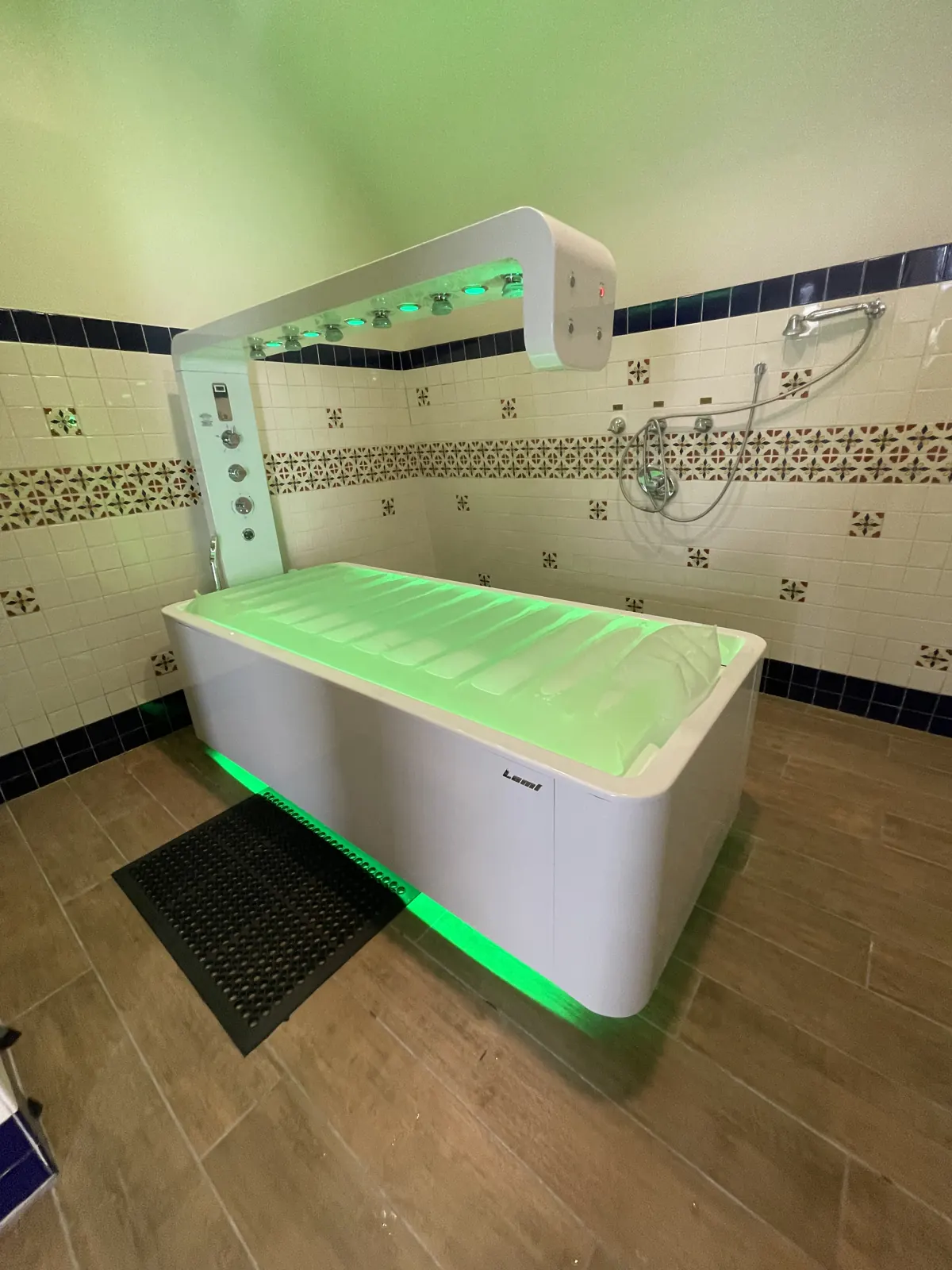 Hydrotherapy spa bed glowing green after repair