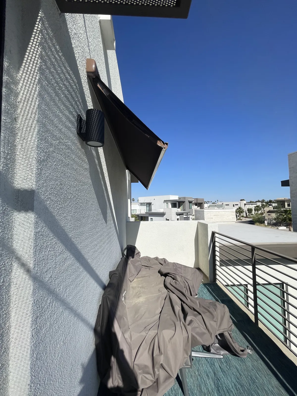 Upper balcony with modern railing on a desert home